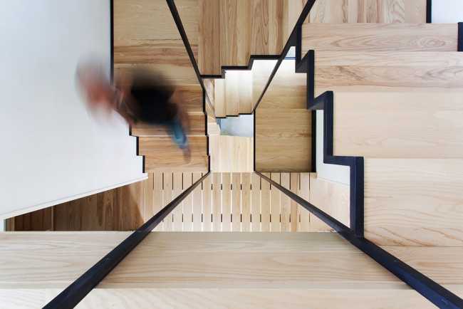 wooden staircase with metal structure